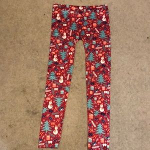 christmas leggings with snowmen and christmas trees on them